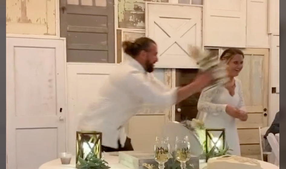 Groom Throws The Whole Cake At His Bride And She Defends Him Tomatoes