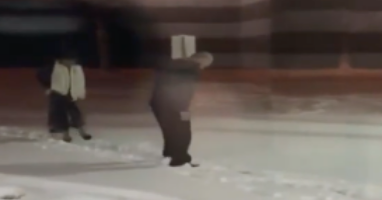 Husband Clears Snow For Wife Using Only His Feet