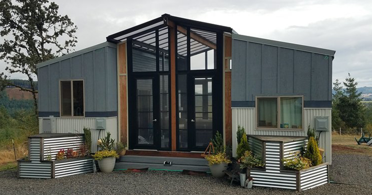 Two Tiny Houses Are Connected With A Deck And Sunroom 12 Tomatoes