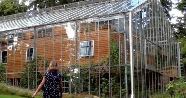 Couple Builds A Greenhouse Around Their Home So They Can Stay Warm During Winter