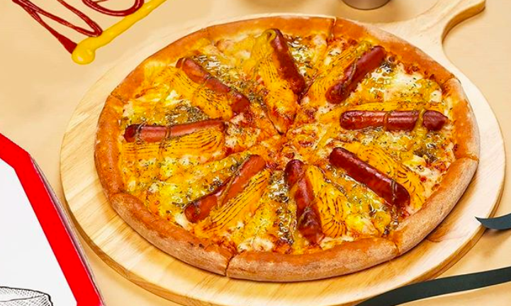 Papa John’s Is Offering A Pizza Covered In Hot Dogs, Mustard, And Relish