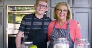American grandmother cooking with her grandson