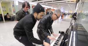 3 musicians entertain weary travelers in London airport