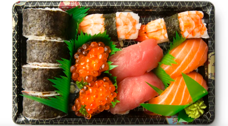 The Real Purpose Behind The Plastic Grass In Your Grocery Store Sushi Box