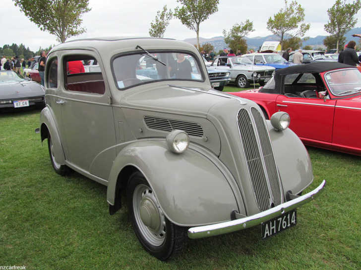 A restored Ford Popular at a car show