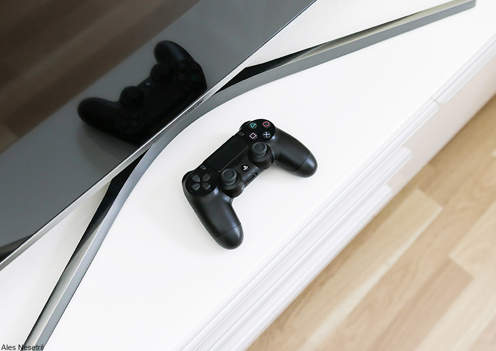 game controller sitting on TV console
