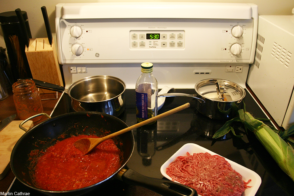 dinner being made on a white stovetop