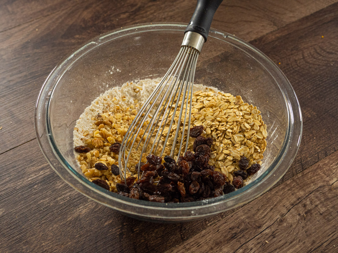 Stir in rolled oats, raisins, and walnuts.