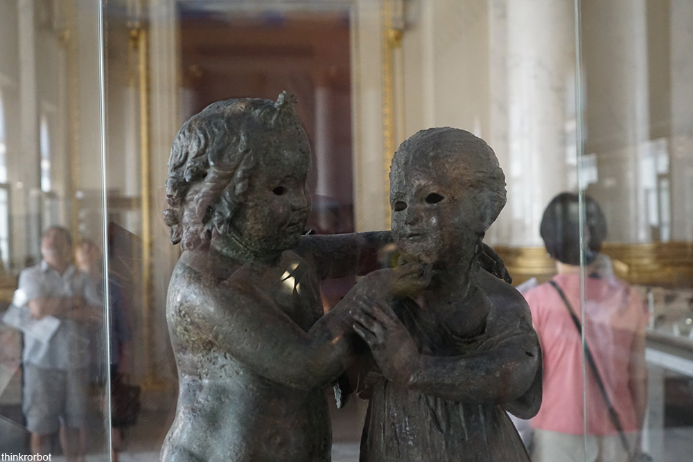 creepy bronze sculpture at the Louvre Museum