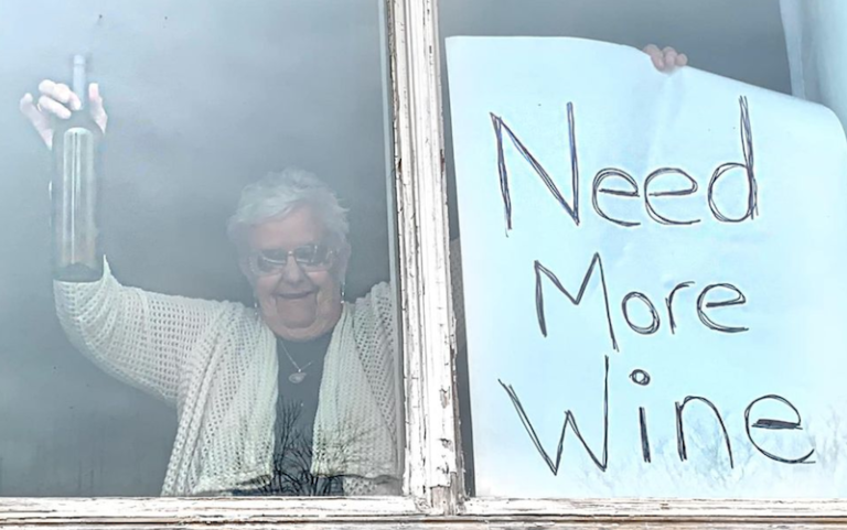 82-Year-Old Woman Goes Viral For Her ‘Needing More Wine’ Sign