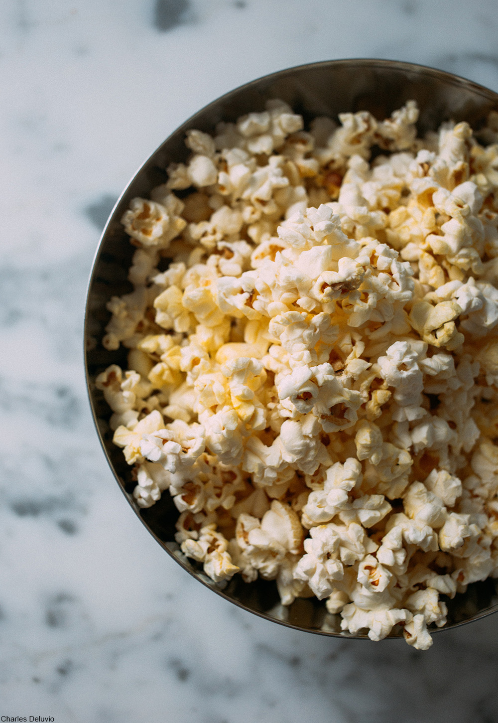 bowl of buttered popcorn