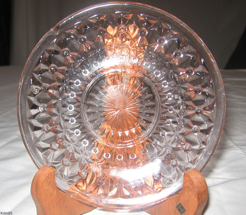Pale pink pressed Depression glass, made to look like cut glass