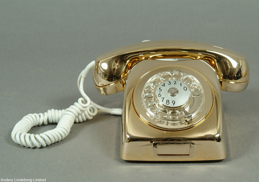 gold and cream rotary phone