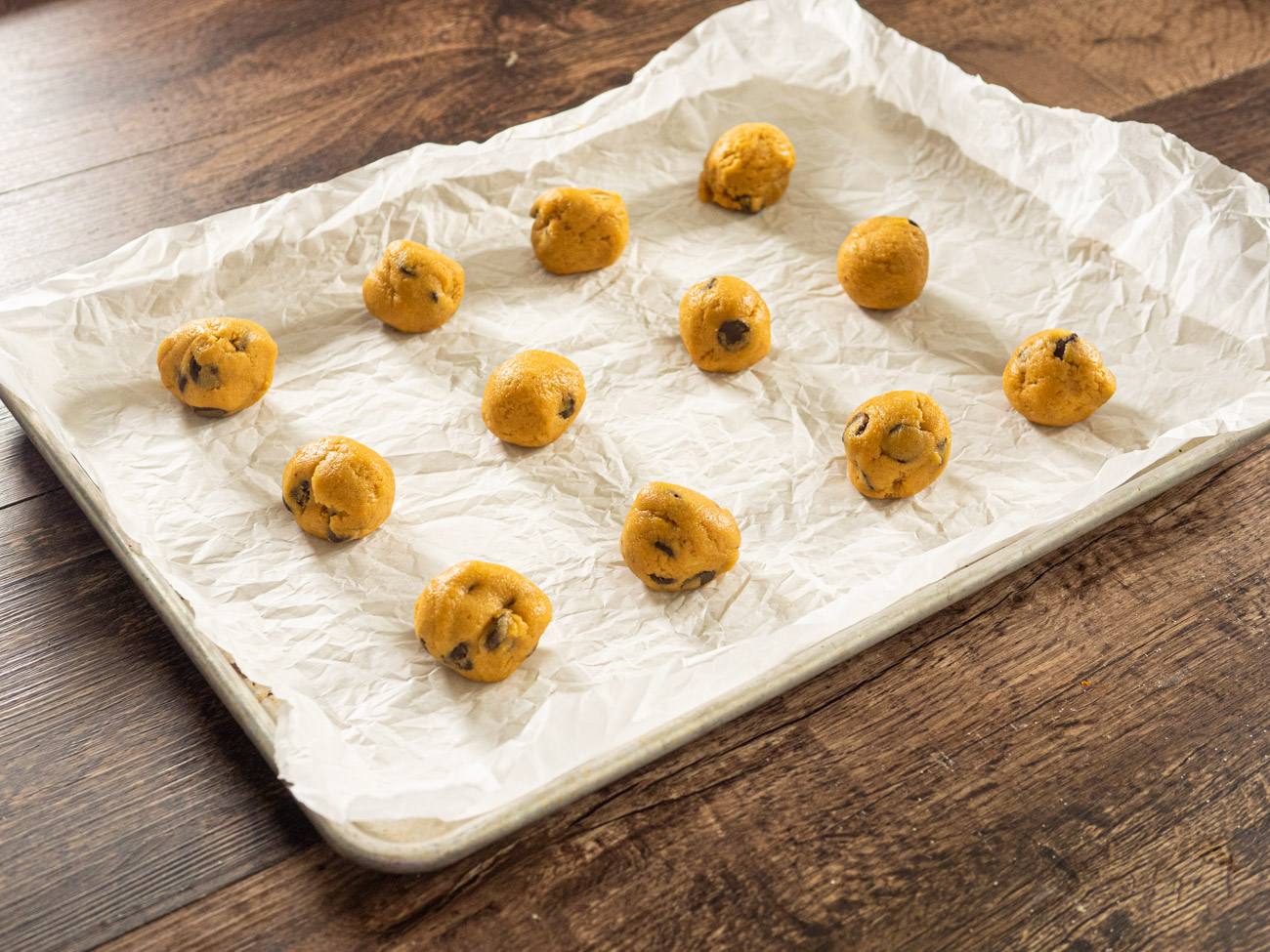 Roll into 1-inch balls or use a small ice cream scoop. Place cookies at least one inch apart on baking sheet.