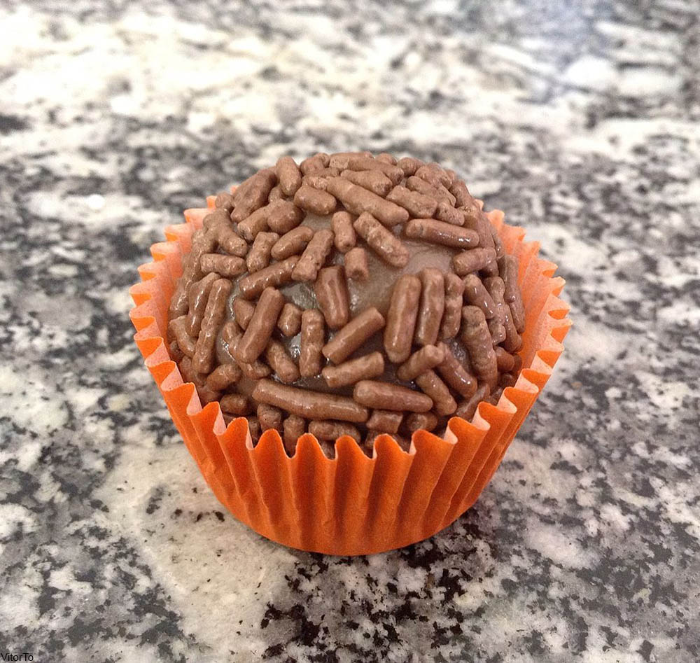 Brigadeiro in orange paper wrapper