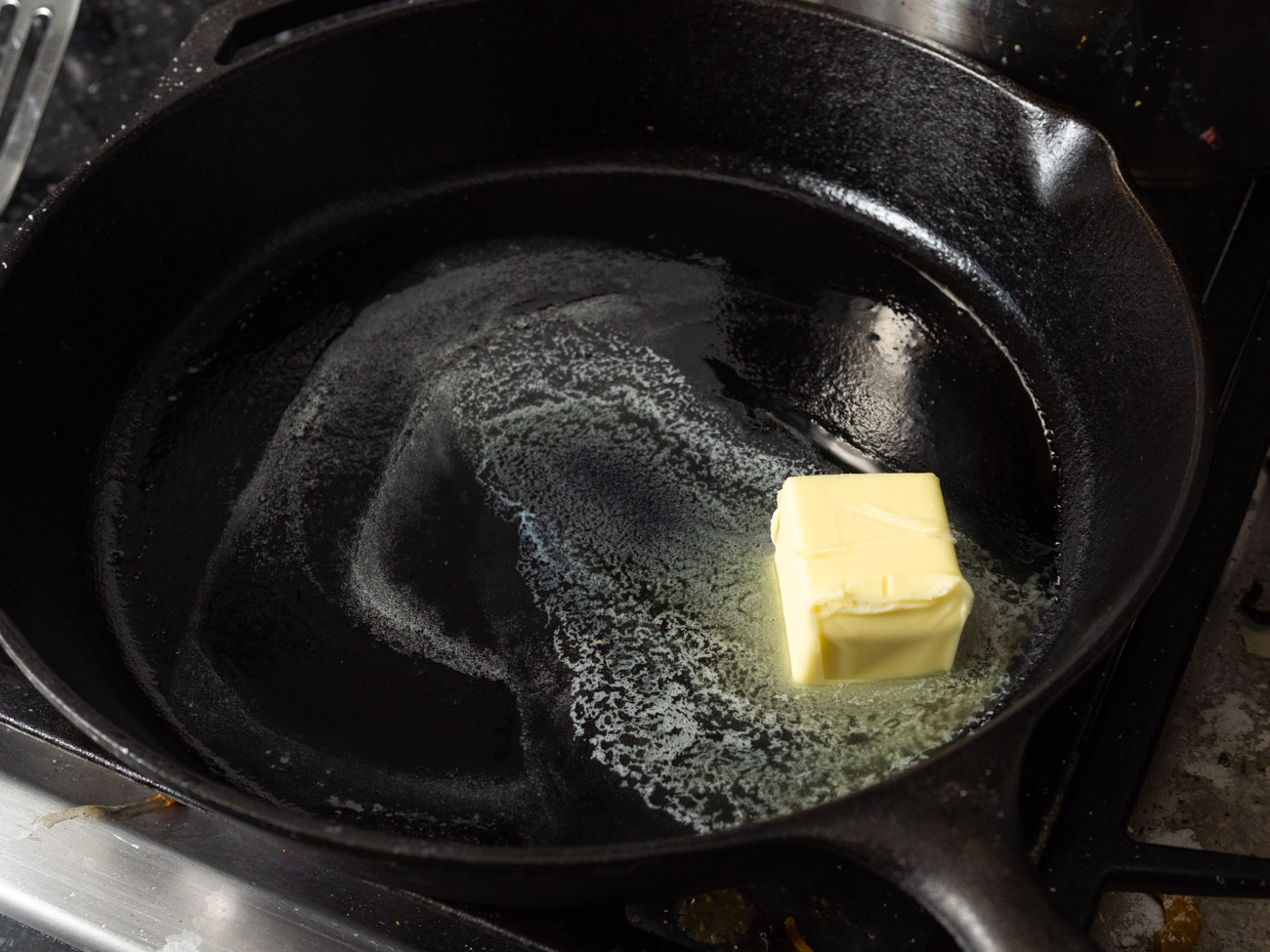 In a large skillet melt butter over medium heat. Add broth and then add beef-potato mixture.