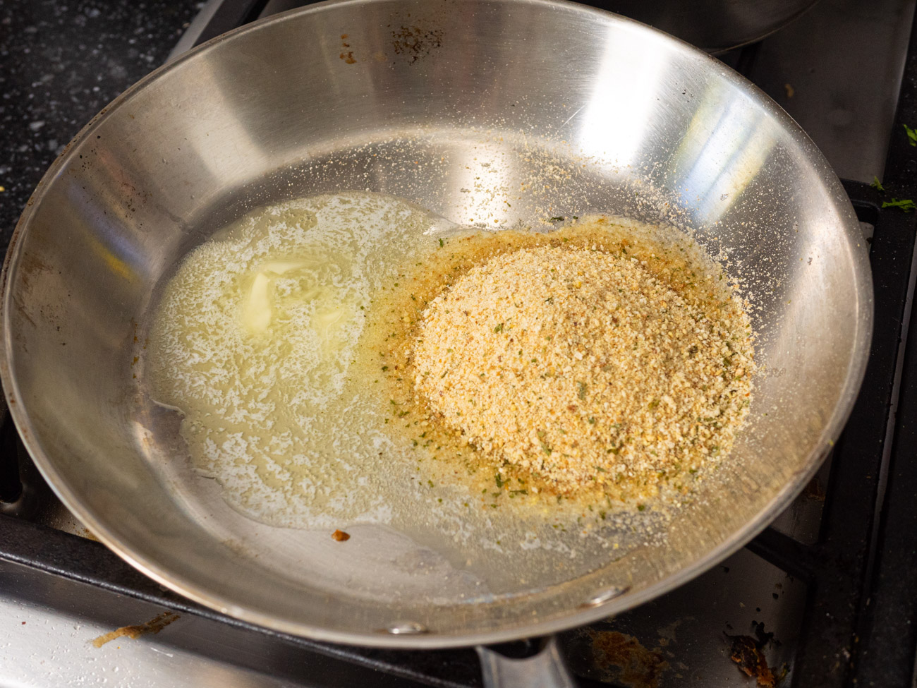 In a skillet, melt the 1 tablespoon butter. Add breadcrumbs and stir until golden brown, 1-2 minutes. Remove from skillet to a bowl and set aside.