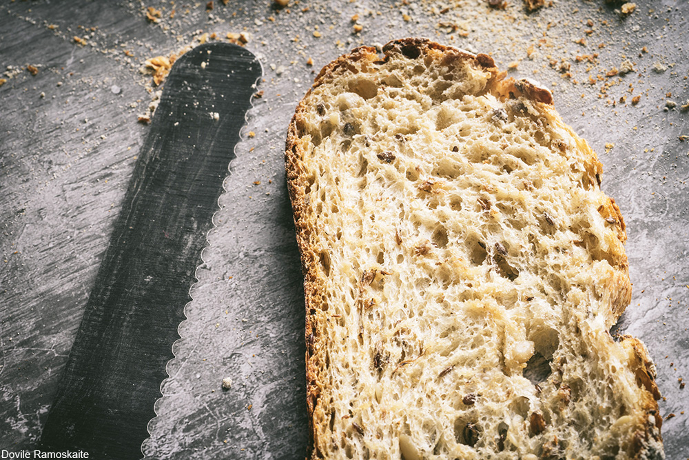 slice of sourdough bread with bread knife