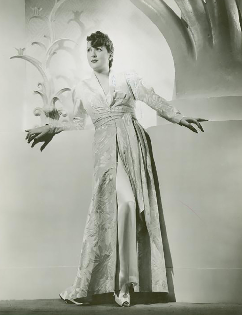 publicity photo of Gypsy Rose Lee in a dressing gown for the 1938 film, Sally, Irene, and Mary