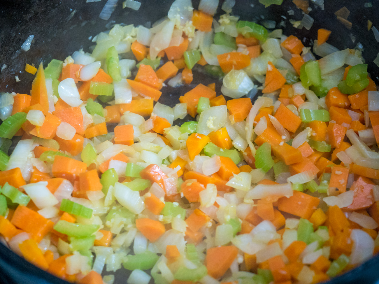 Heat the olive oil in a large Dutch oven over medium-high heat. Add onion, carrots, and celery and cook until softened, about 5 minutes. Add garlic and cook 1 minute more.