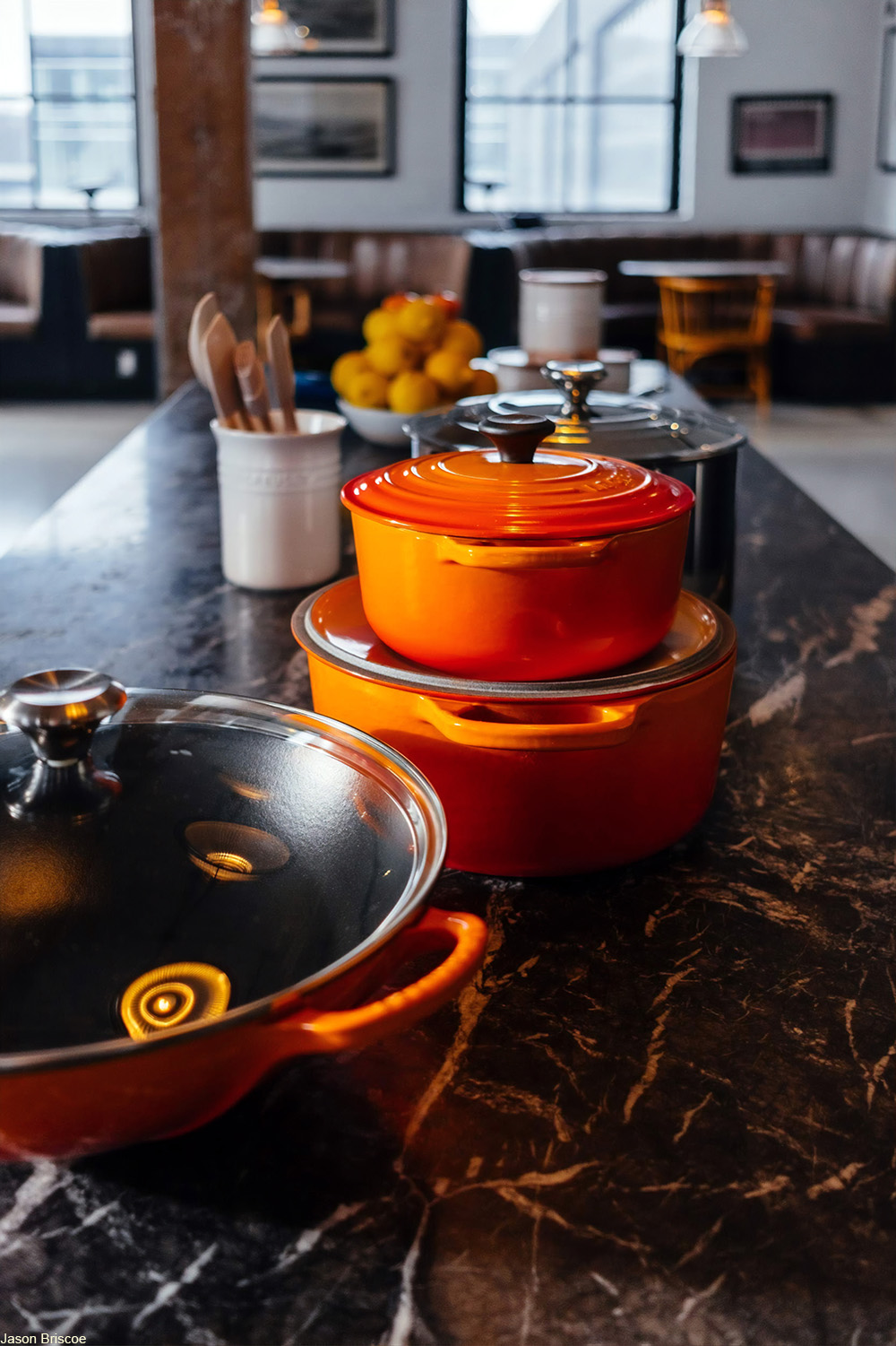 selection of lidded pots and pans on a countertop