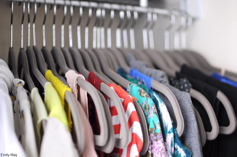 clothes on hangers in closet