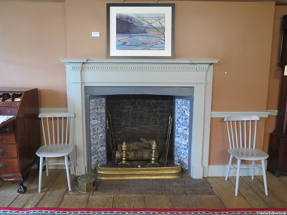 Dyckman Farmhouse sitting room with Delft Blue tiles lining the fireplace