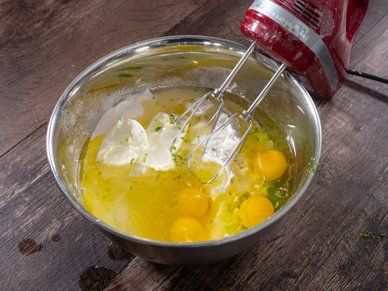 In a large bowl combine cake mix, pudding mix, eggs, sour cream, water, lime zest, and oil until well blended.