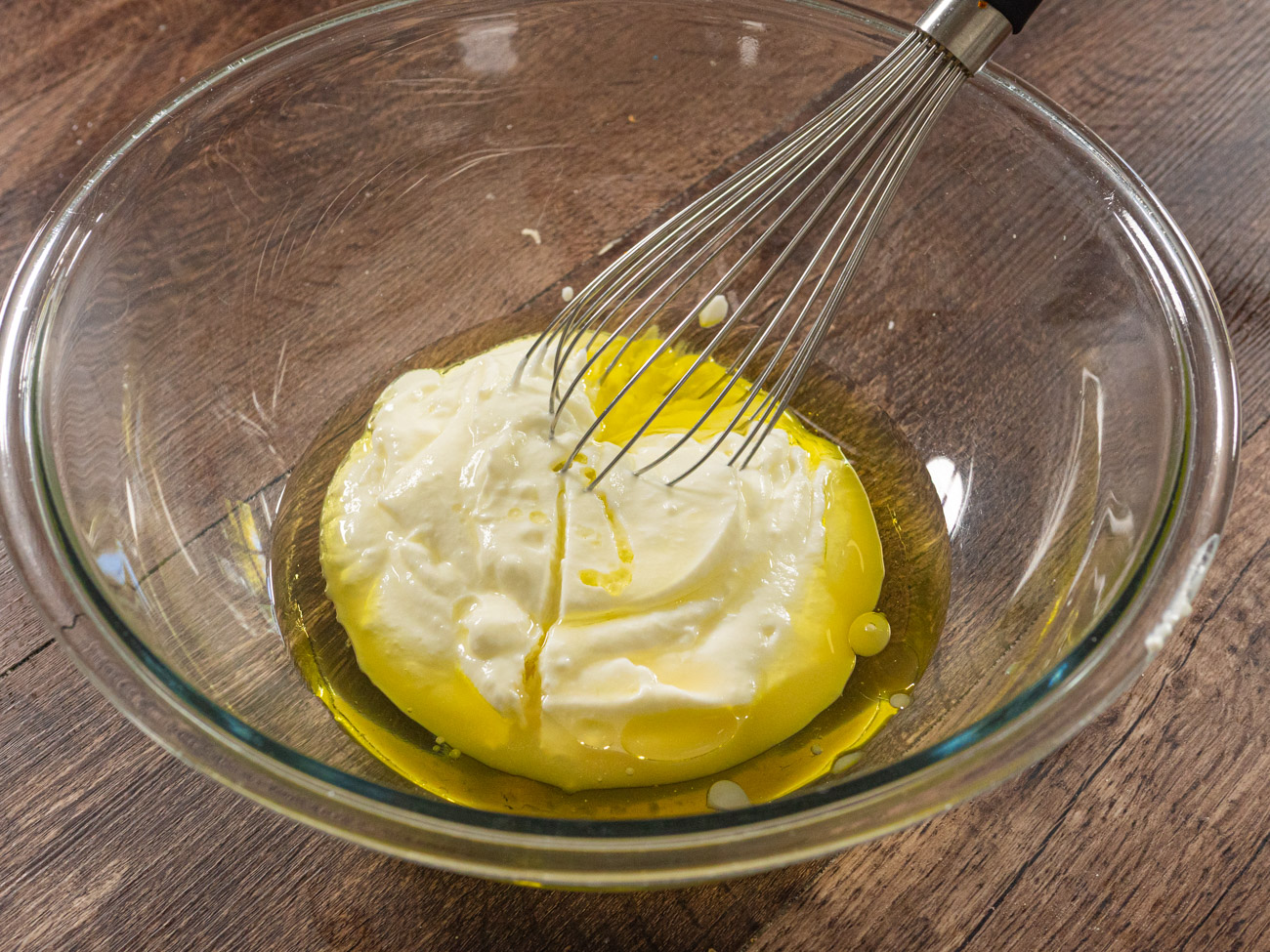 Whisk together yogurt, olive oil, and lemon juice together in large bowl. Add jalapeño pepper, green onion, and bread and stir to coat all pieces. Let stand for 10 minutes.