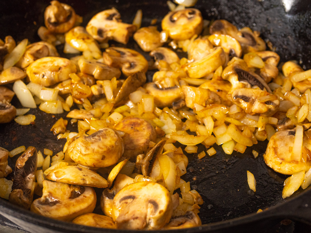 Add onion and cook until starting to soften, about 3 minutes. Add mushrooms, season with salt, and cook 5 minutes.