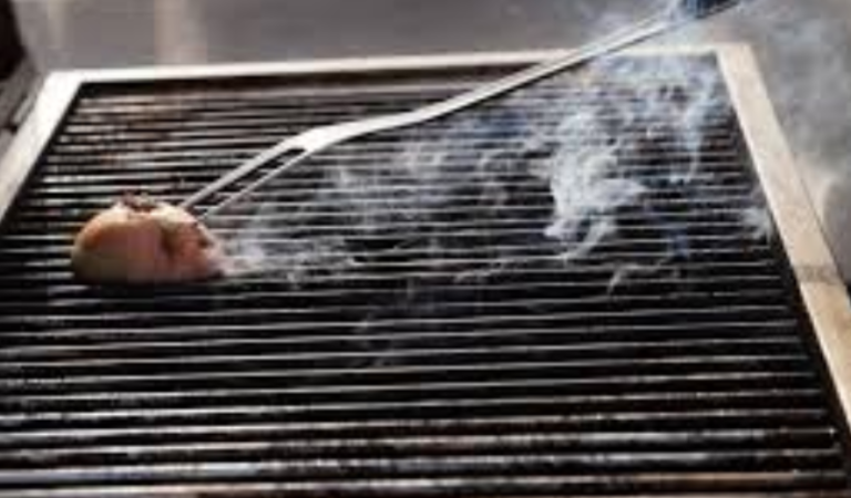 Why You Should Be Cleaning Your Grill With An Onion