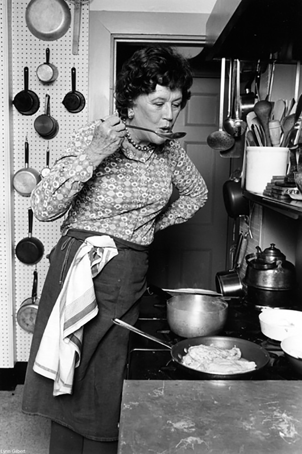 publicity photo of Julia Child in her Cambridge kitchen in the 1970s