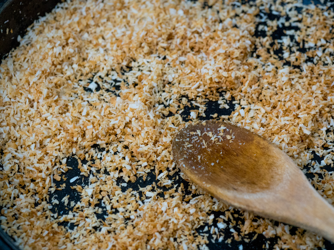 Preheat oven to 375˚F. Heat a skillet to low-medium heat. Place 1/2 cup shredded coconut in skillet and stir constantly until toasted. Do not overcook. Remove from pan and set aside.