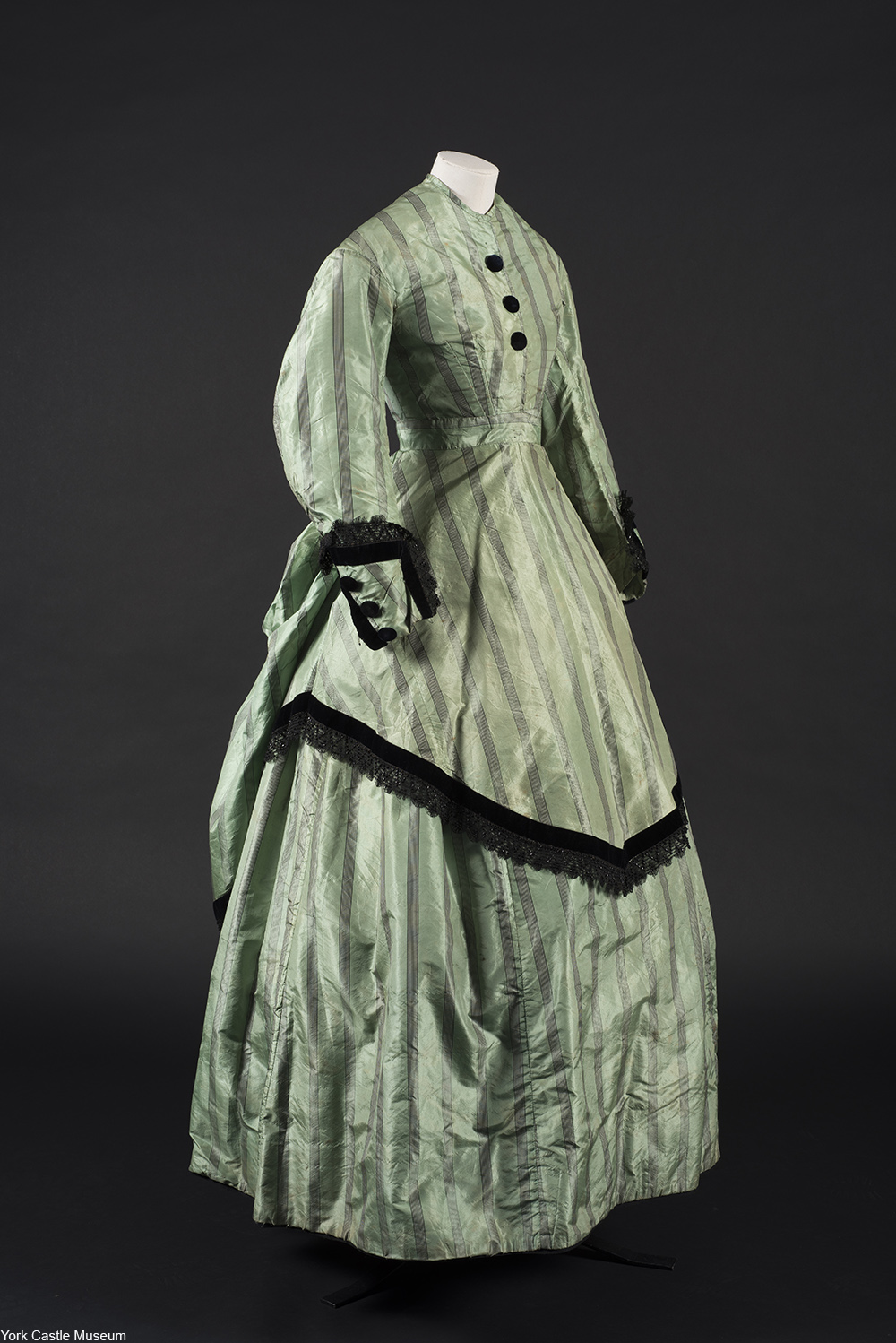 Victorian dress in green and black made with arsenic dyes that is still leeching poison