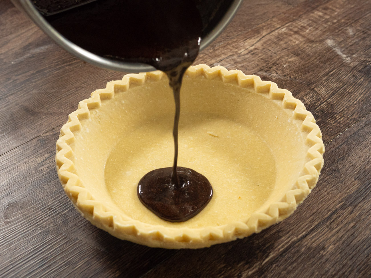 Pour cocoa mixture into unbaked pastry shell and turn pie so that chocolate mix comes up the sides halfway. Set aside.