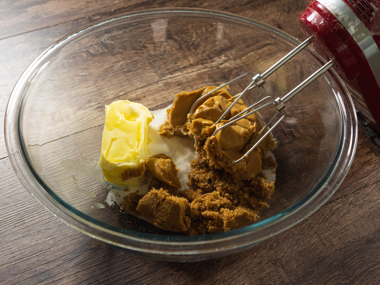 In a large bowl cream together the white and brown sugar with the butter and also the creamy peanut butter using an electric mixer. Add eggs one at a time, followed by the vanilla.