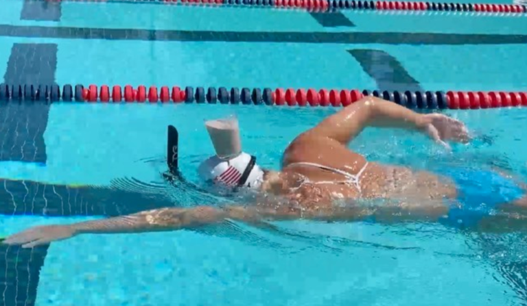 Olympic Swimmer Does Laps With A Glass Of Milk On Her Head
