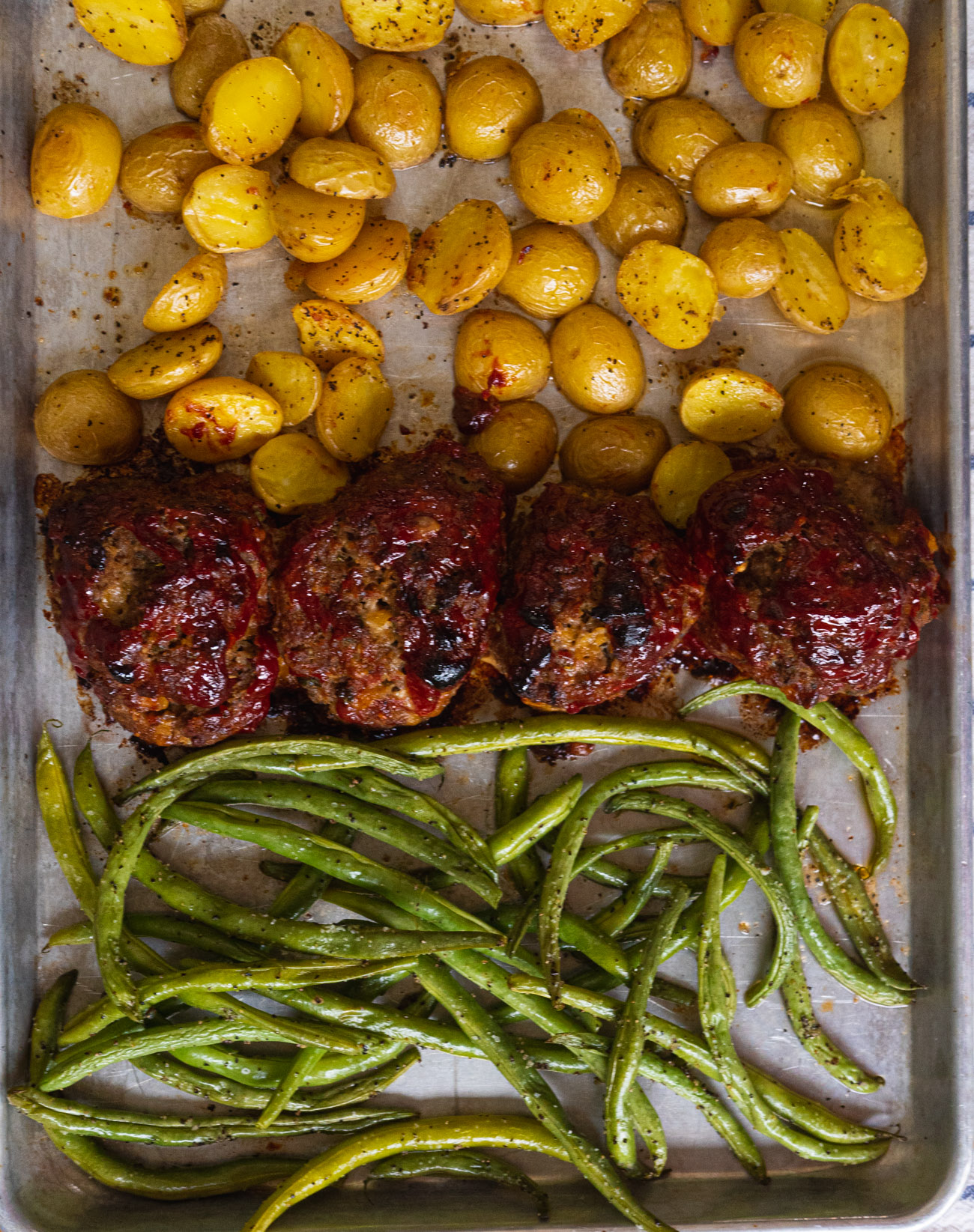 https://cdn.greatlifepublishing.net/wp-content/uploads/sites/2/2020/08/12132403/Mini-Meatloaf-Sheet-Pan-Dinner-Vertical-10-of-32.jpg