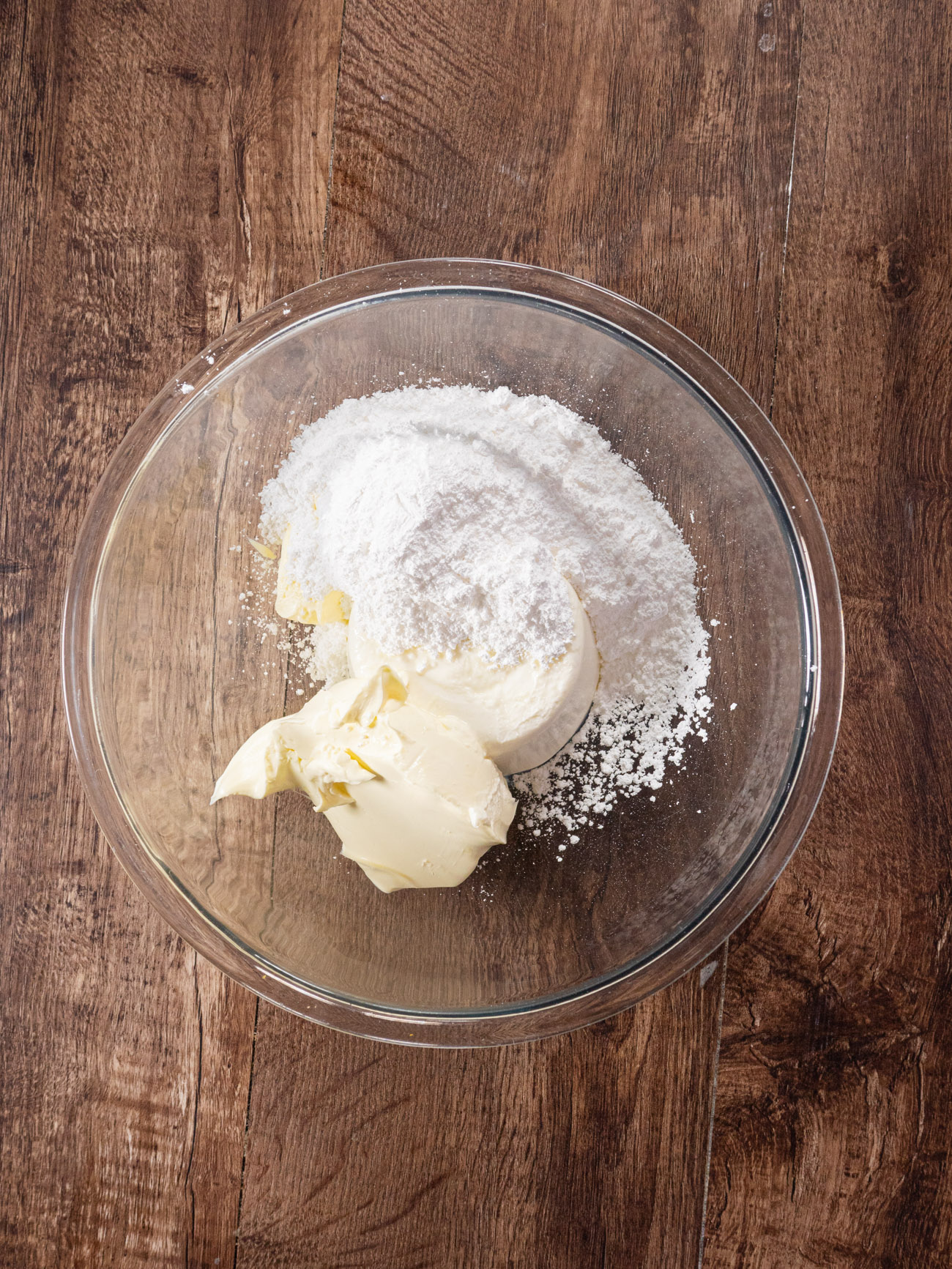 In a large mixing bowl, combine ricotta, mascarpone, and powdered sugar. Beat with an electric mixer until smooth.