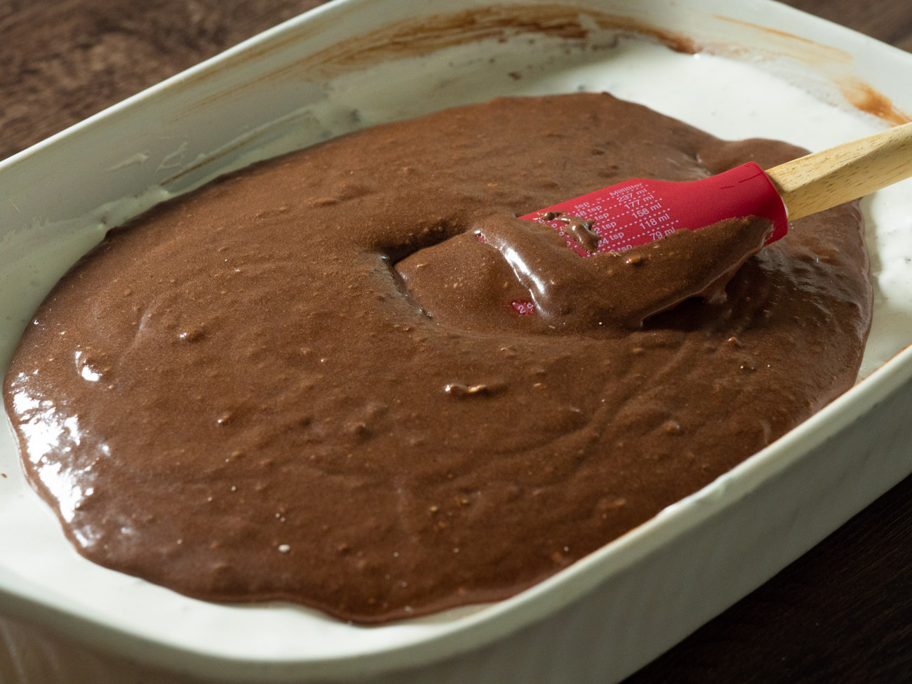 In a large bowl combine butter, vanilla, powdered sugar, cocoa, and evaporated milk. Allow cake to cool completely before adding icing on top using an icing knife, offset spatula, or even the back of a spoon.