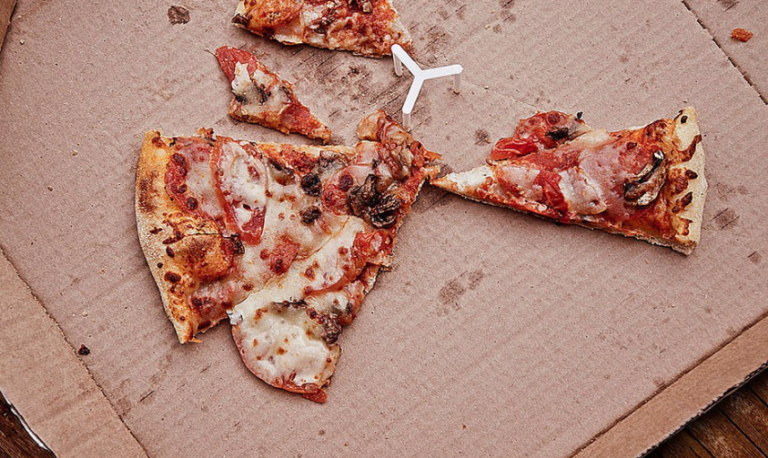 How To Salvage Leftover Pizza By Reheating It In A Waffle Iron