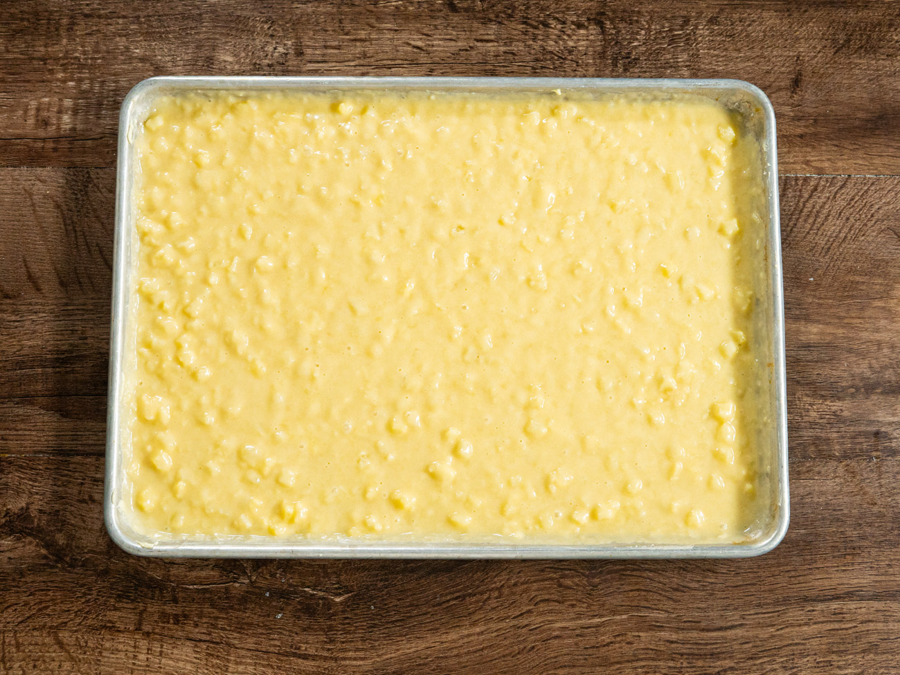 Pour the batter into the prepared sheet pan and bake for 25-30 minutes.