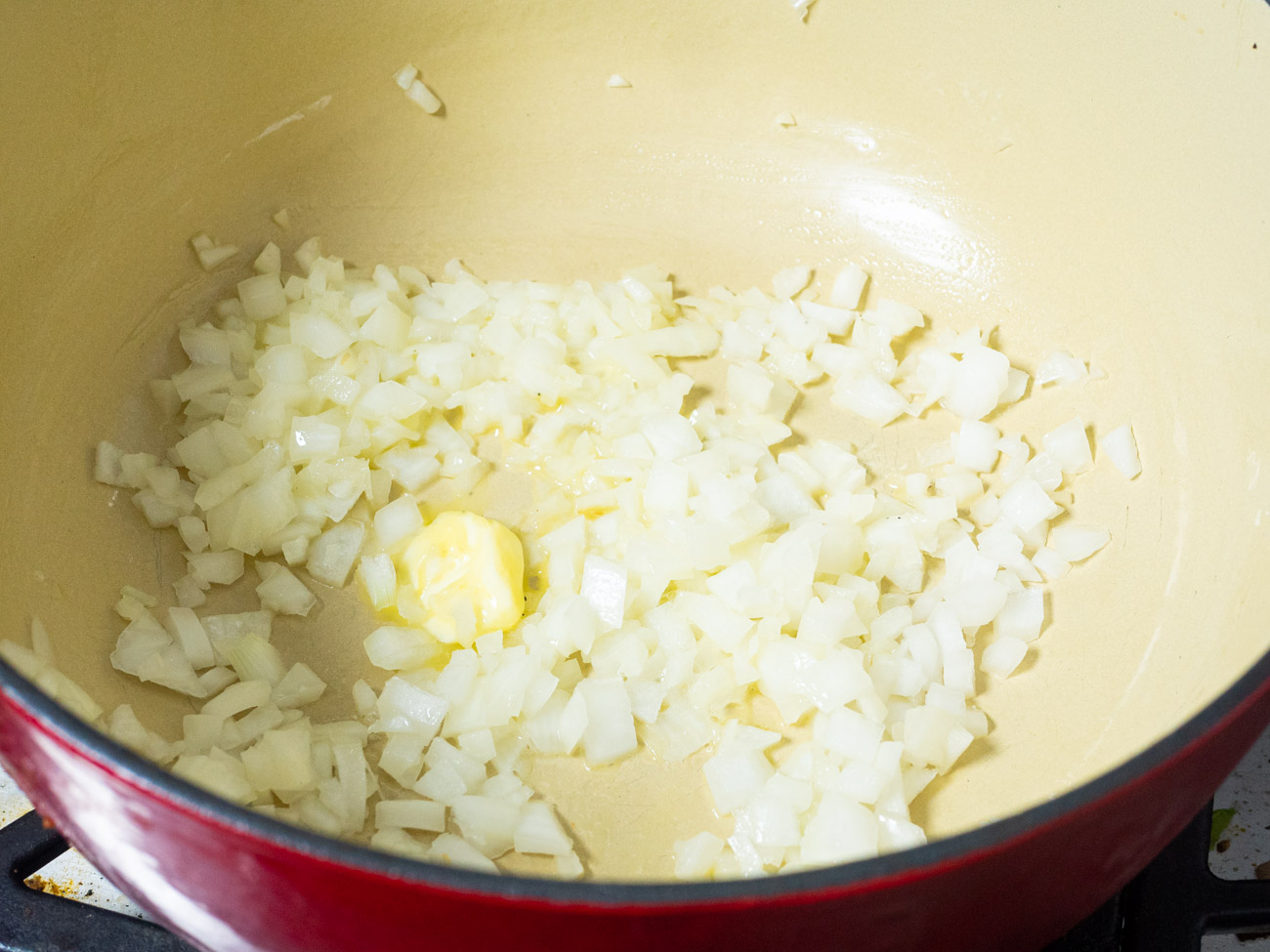 Melt butter in a large pot over medium-high heat. Add in the onion and sauté for 3-5 minutes, until tender.