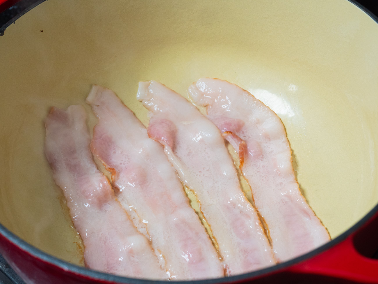 In a large pot, cook bacon until crisp. Transfer to a paper towel lined plate to drain.