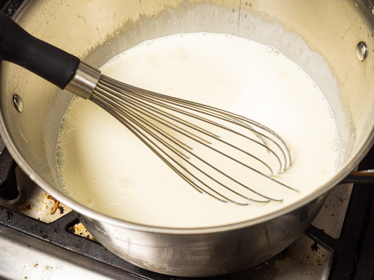 Combine 3 cups of the cream with milk and sugar in a large saucepan. Bring to simmer over medium heat, stirring constantly until sugar is dissolved. Remove from heat and whisk in 2 cups of the white chocolate chips until they are melted and fully incorporated. Allow to cool for 10 minutes.