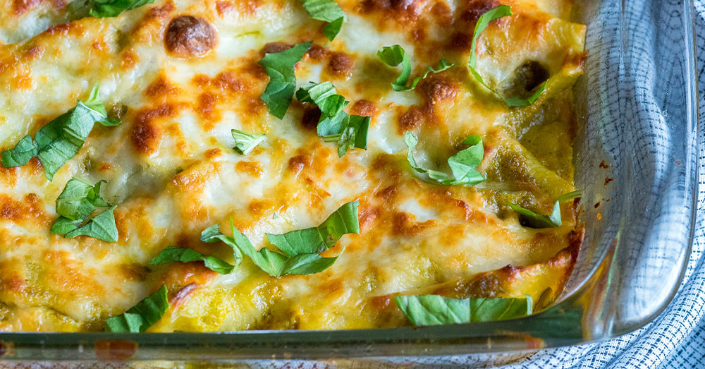 Bake for 20-25 minutes or until the cheese has melted and is lightly browned on top. Serve with fresh basil. Enjoy!