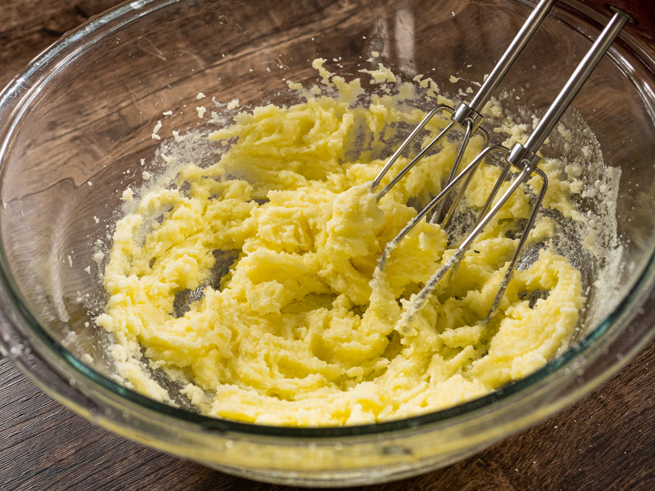In a large bowl or stand mixer bowl cream together butter and sugar (4-5 minutes with an electric mixer on high).