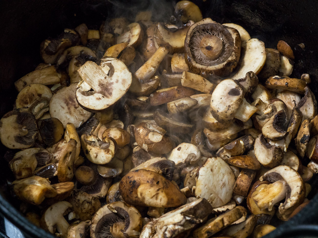 Melt half of the butter in a pan over medium-high heat. Add mushrooms and cook until about 10-15 minutes, or until all of their liquids have been cooked out.