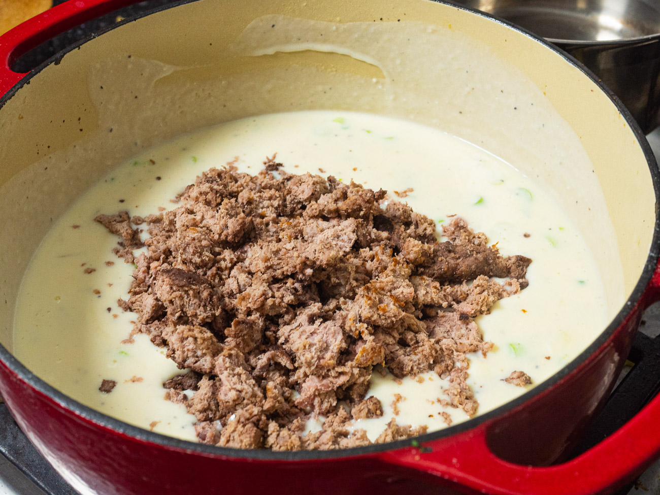 Add in potato, cheese, scallion, yogurt and sour cream and stir. Cook until soup begins to bubble. Add in meatloaf (or cooked ground beef if you don’t have any leftover meatloaf on hand) and cook about 5 minutes to heat the meatloaf crumbles.