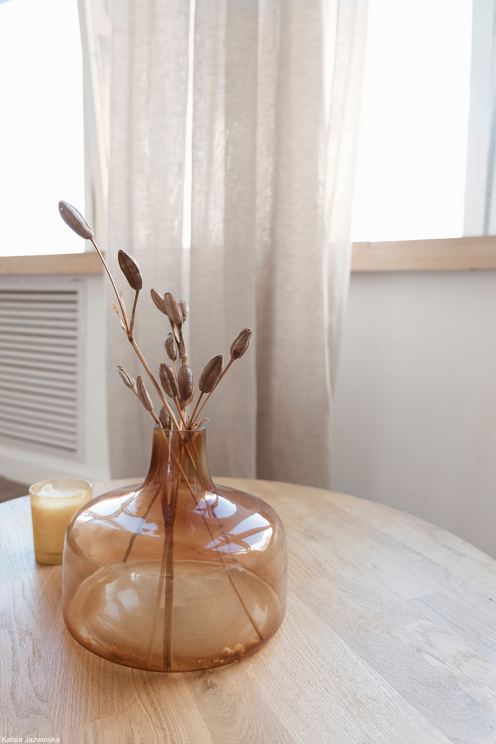 glass vessel with dried plants inside